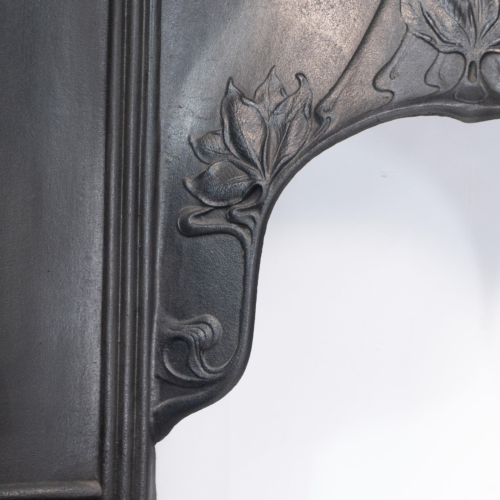 photo for sale Arts & Crafts Cast Iron Fireplace With Curved Sides & Stylized Floral Decoration