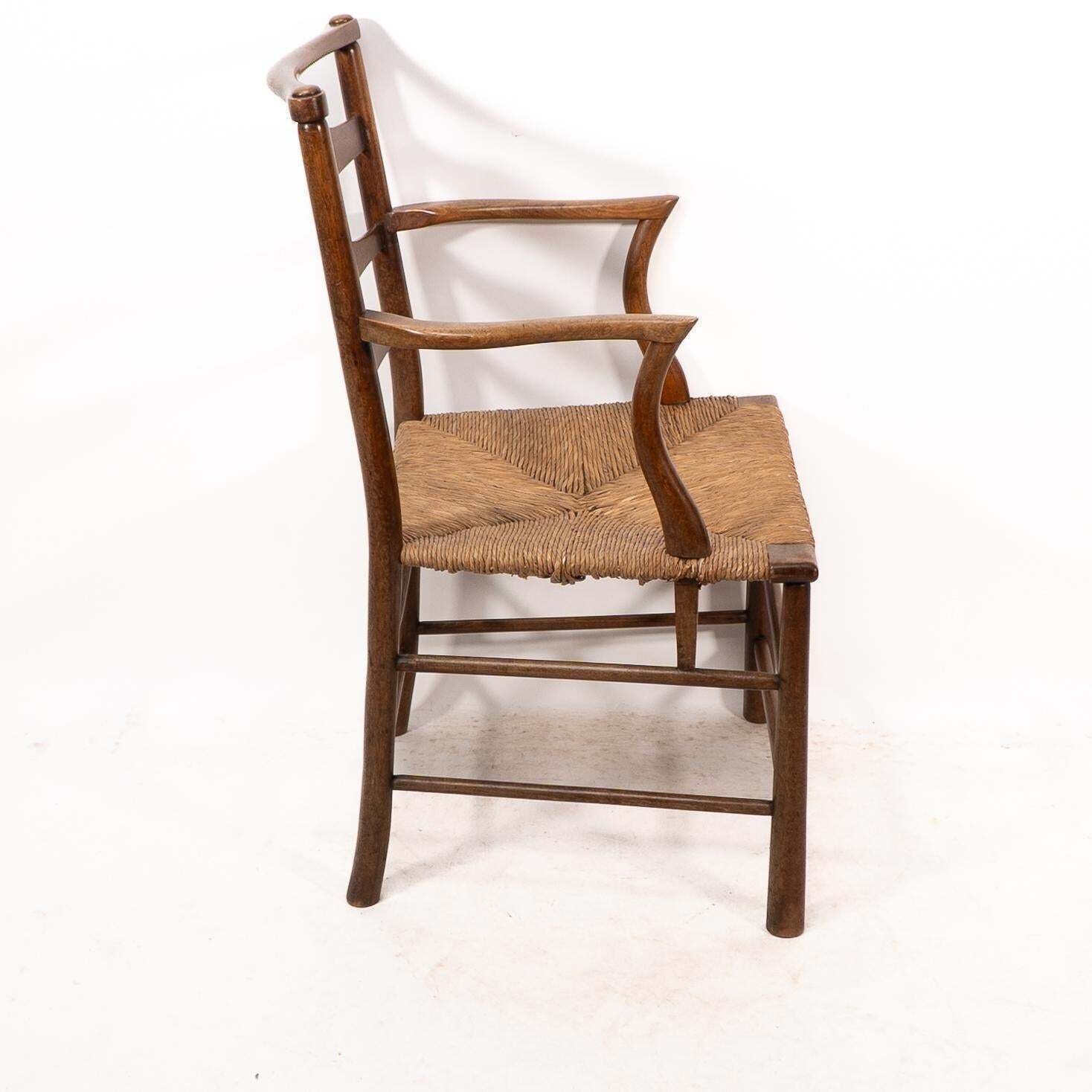 C R Ashbee. An Arts And Crafts Rush Seat Ladder Back Armchair photo Furniture