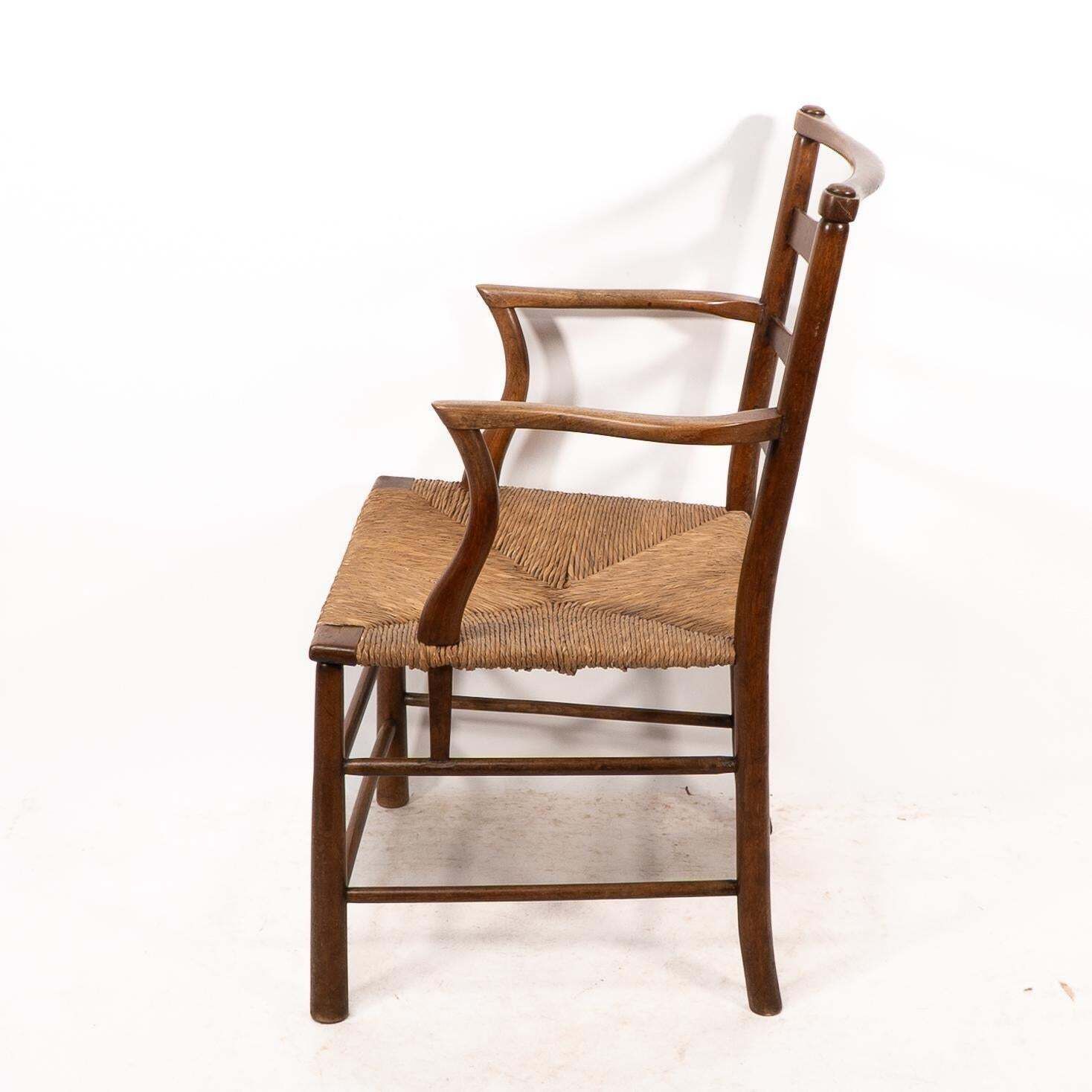 C R Ashbee. An Arts And Crafts Rush Seat Ladder Back Armchair photo 3875.0