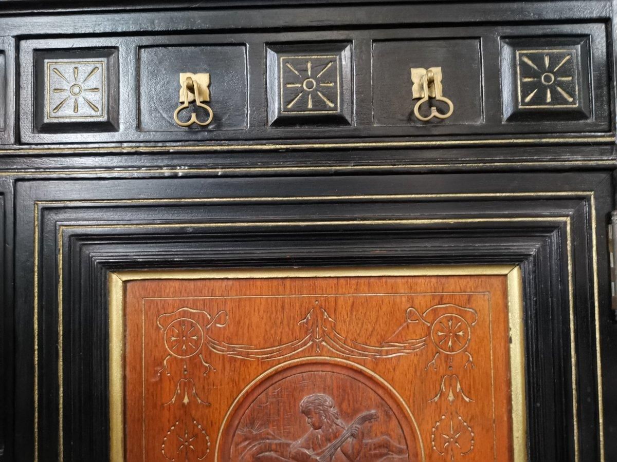 Aesthetic Movement Side Cabinet With Carved Panels Of Putti Putti Playing Music. photo buy