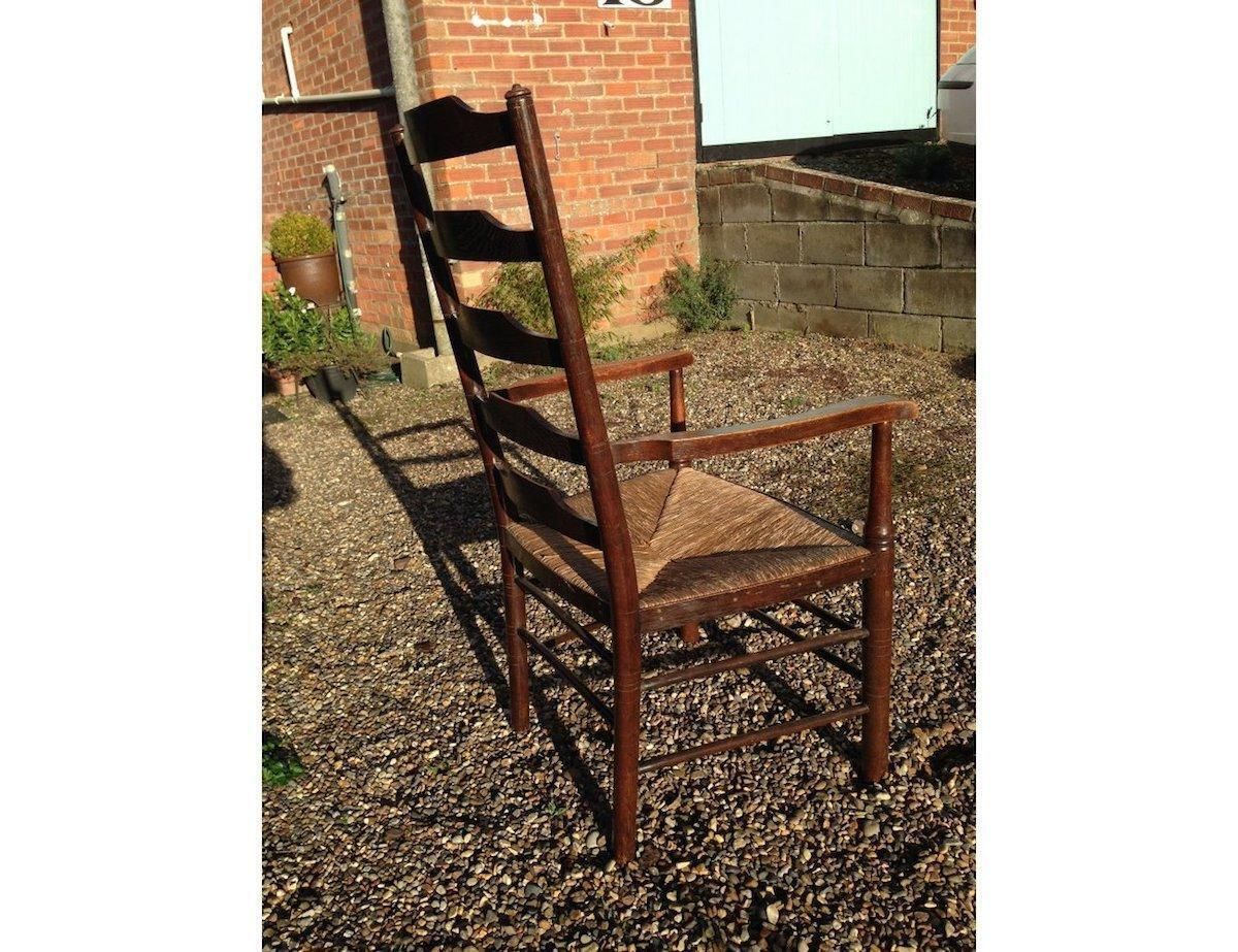 An English Cotswold School Oak Ladder Back Rush Seat Armchair photo furniture