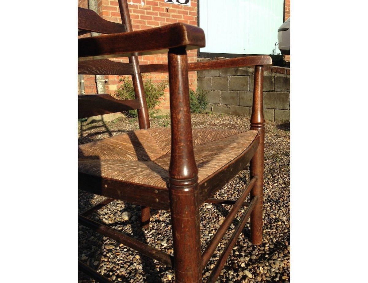An English Cotswold School Oak Ladder Back Rush Seat Armchair photo buy
