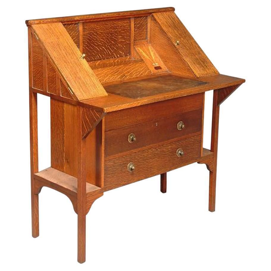 G M Ellwood For J S Henry. An Arts & Crafts Oak Writing Desk