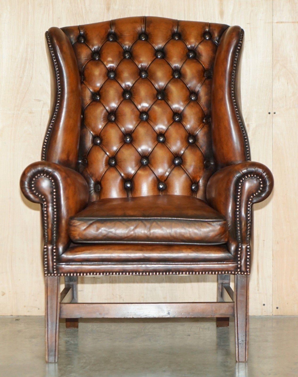 Comfortable Restored Whiskey Brown Leather Tufted Chesterfield Wingback Armchair photo for sale
