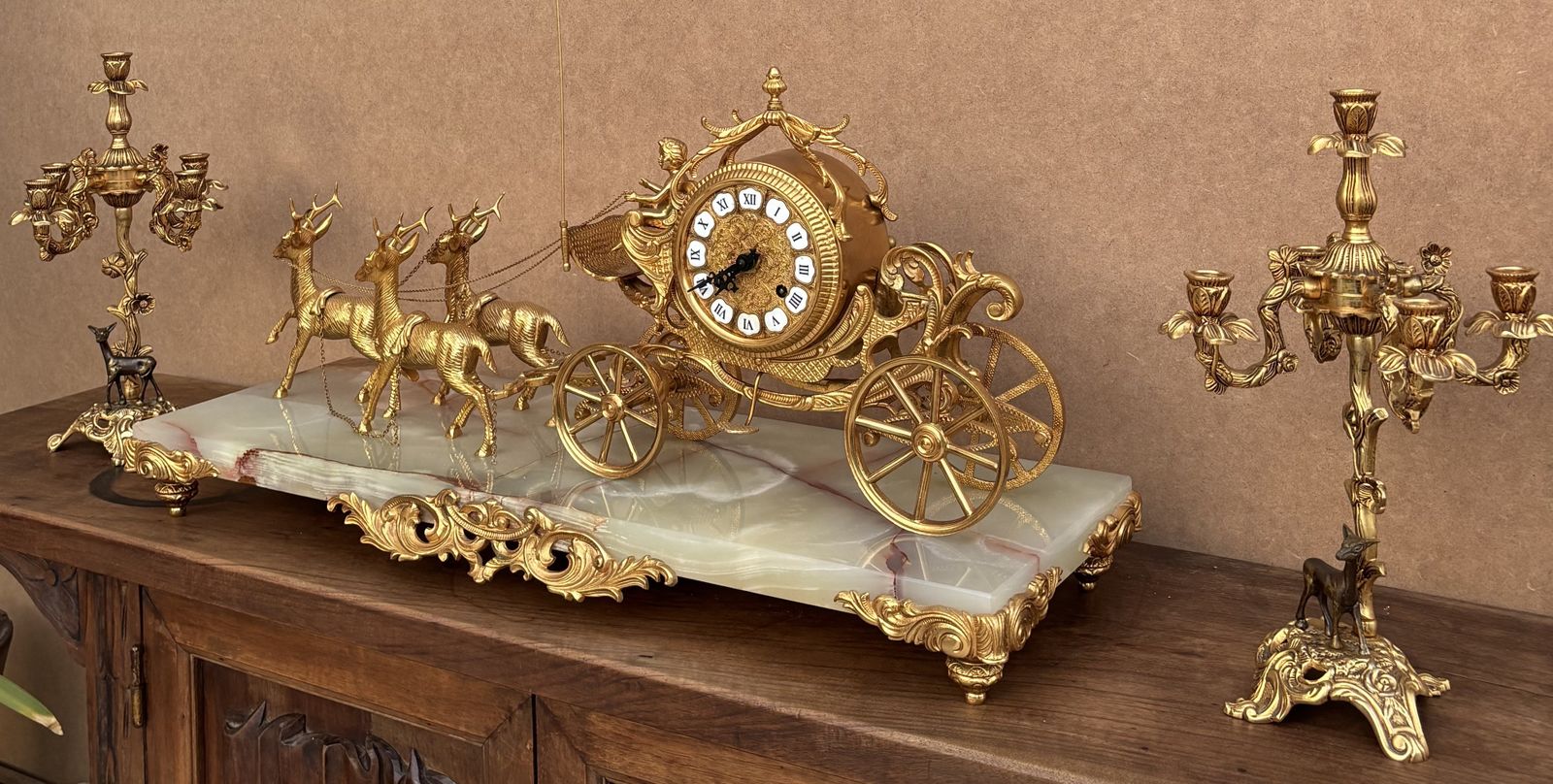 photo for sale Early 20th Century Set Of Carriage Clock With Deer And Candlesticks In Gilt Bronze On A Marble Base