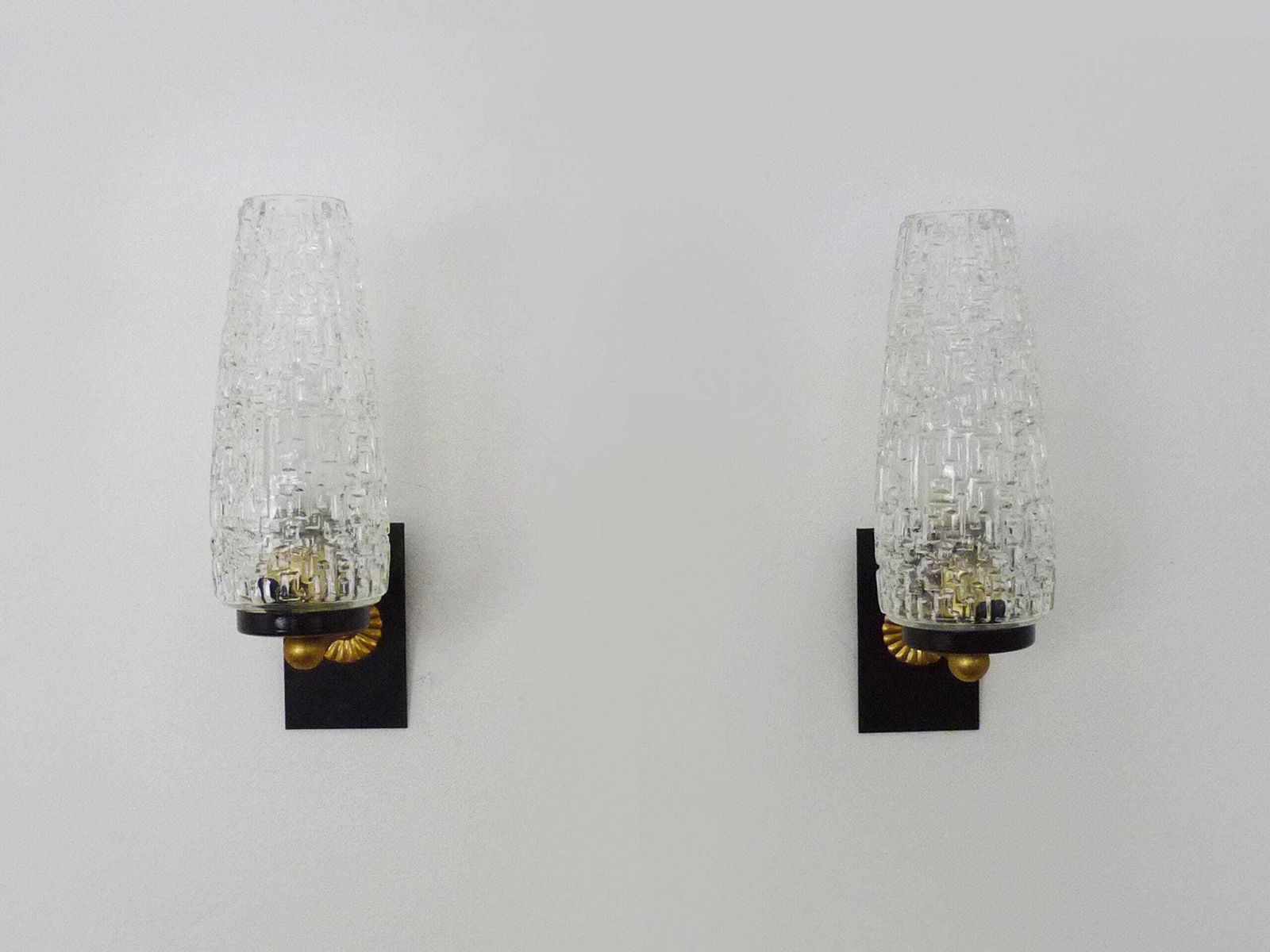 Superb Pair Of Brass Wall Sconces With Glass Globes. The Black Wall Part Is Made Of Metal. photo for sale
