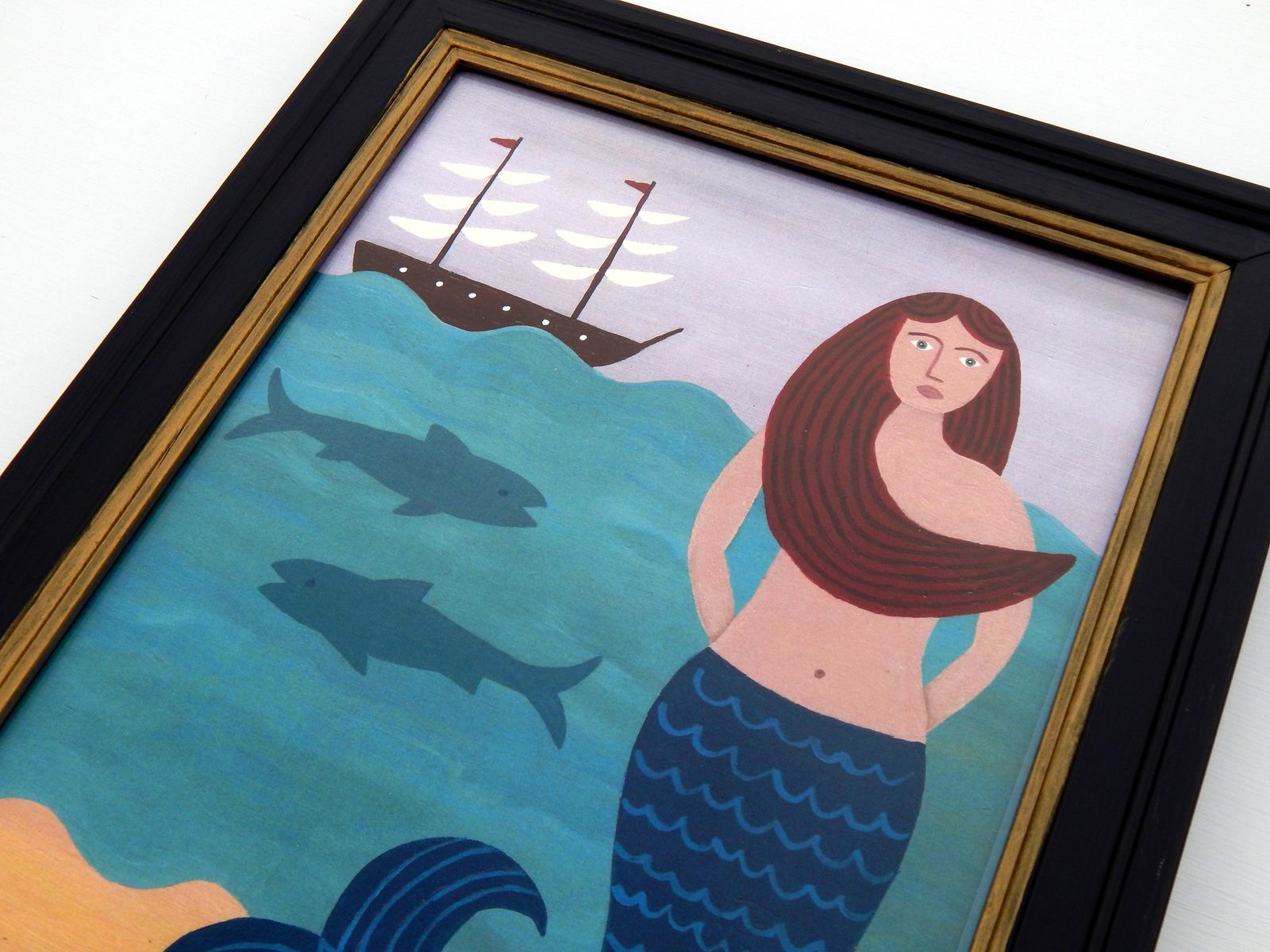 Naive Mermaid Folk Art Print With Sailboat, Ocean Waves, And Hand Painted Black Frame By Matt Rix photo vinterior