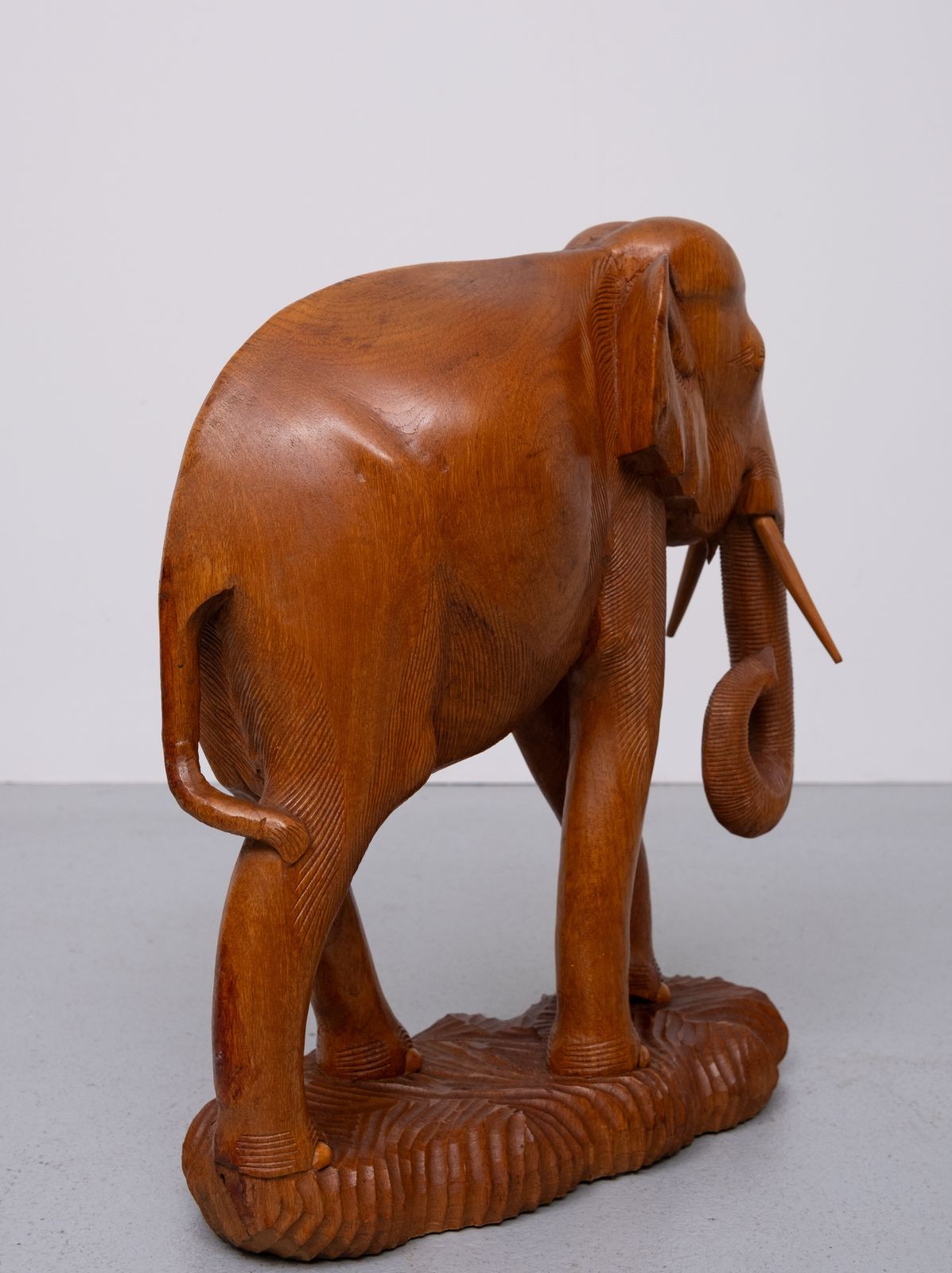 photo for sale Large Carved Teak Elephant Statues Together With A Smaller Elephant 1950s
