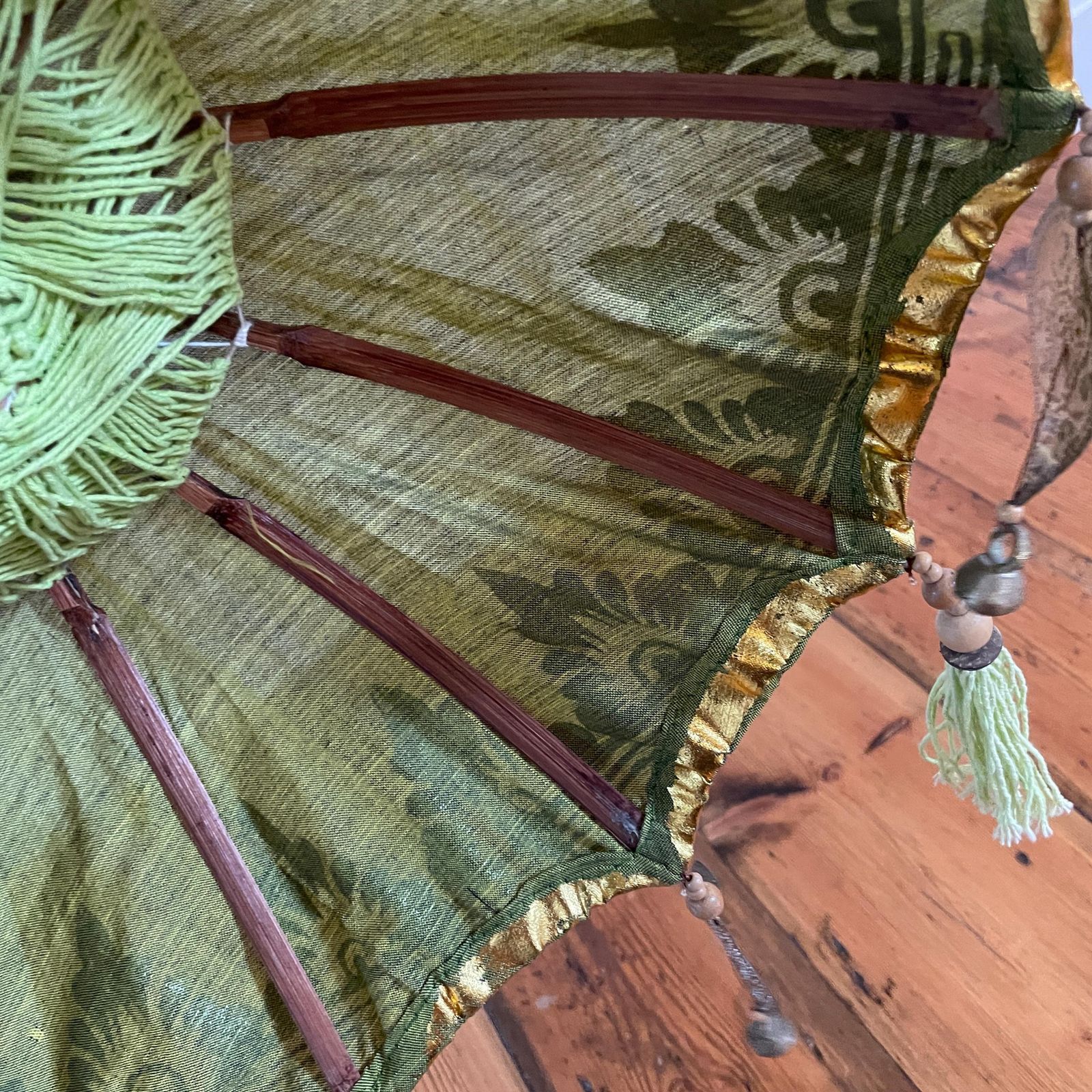 photo buy Balinese Green Gold Parasol Umbrella Decorative Tassel Temple Shade Stand Boho Exotic Vintage Decor Handcrafted Bali Art Wooden Base Accent