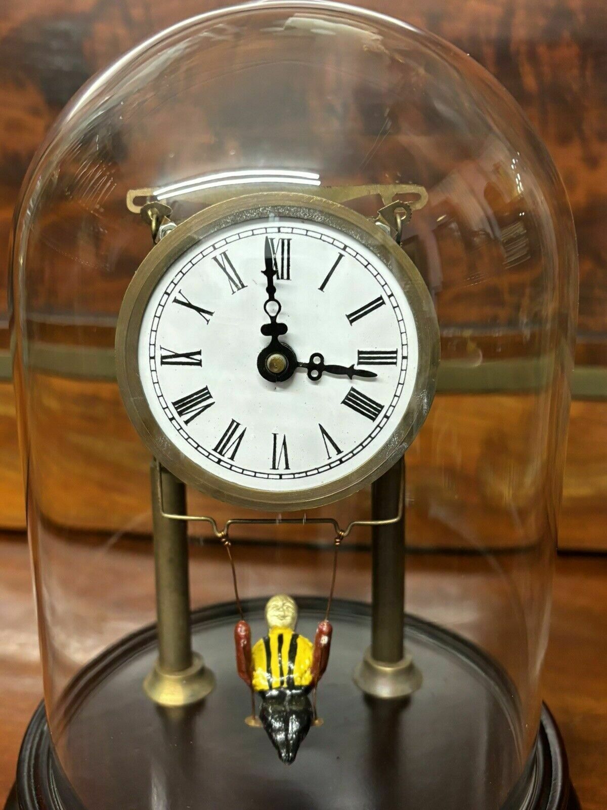 Skeleton Clock In Case With Girl On Swing Pendulum. photo furniture
