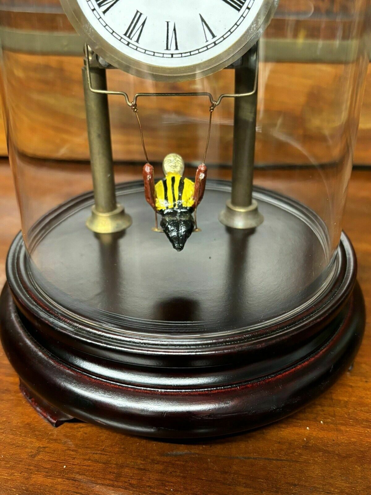 Skeleton Clock In Case With Girl On Swing Pendulum. photo for sale