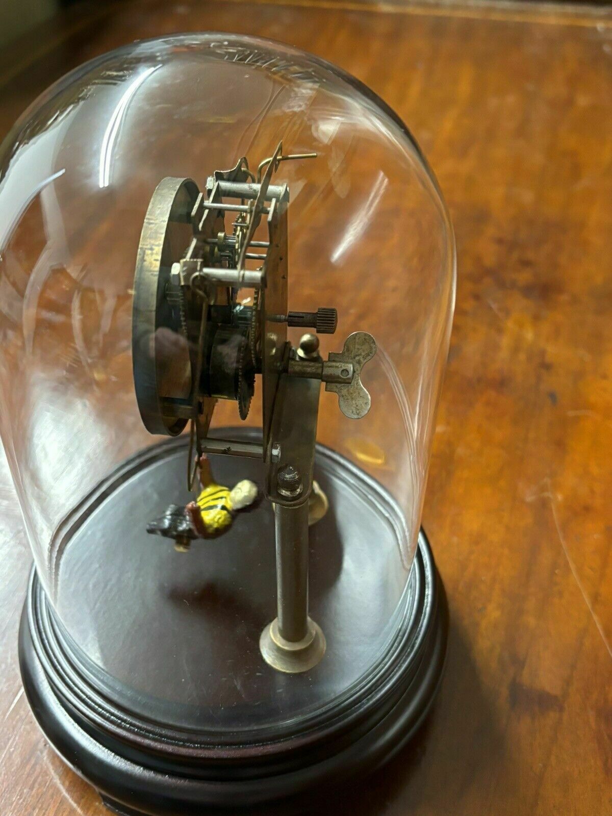 Skeleton Clock In Case With Girl On Swing Pendulum. photo Home Decor