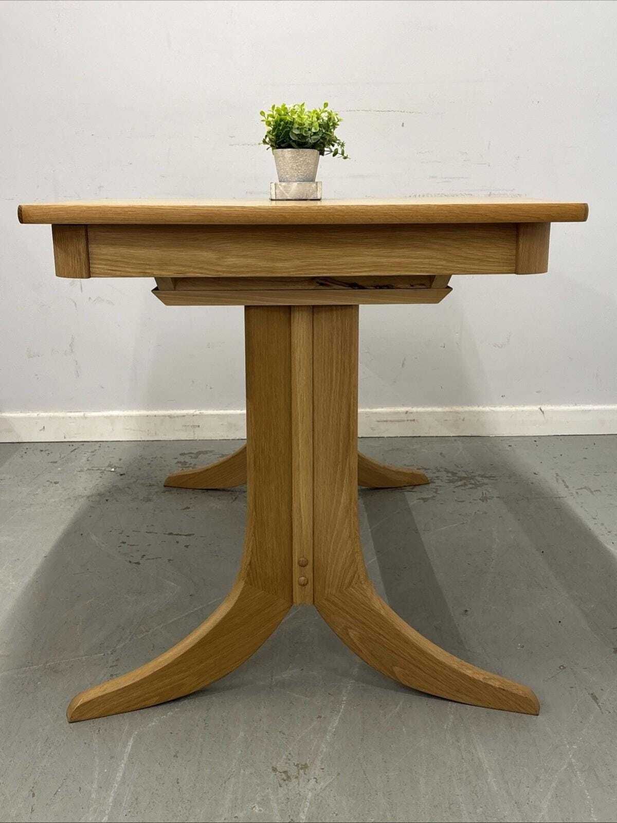 Nathan Shades Boat Shaped Extending Dining Table – Oak Finish photo 795.0
