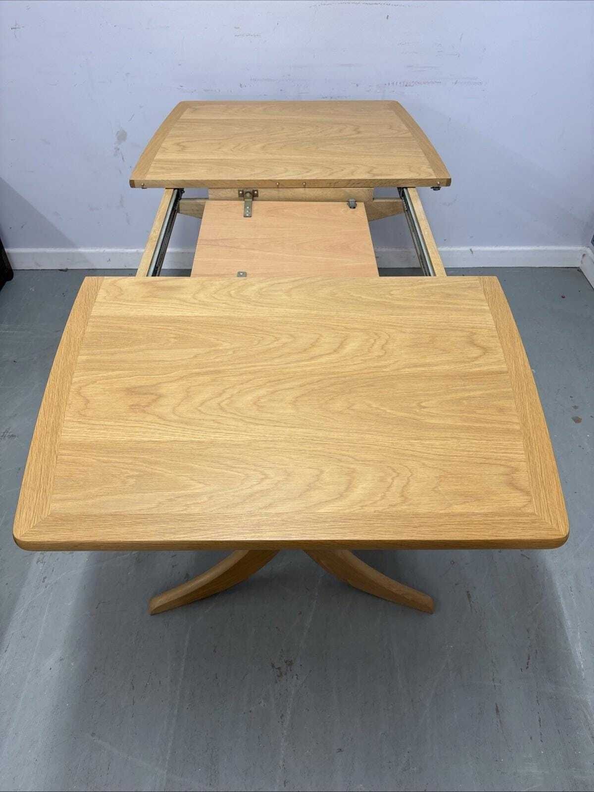 photo furniture Nathan Shades Boat Shaped Extending Dining Table – Oak Finish