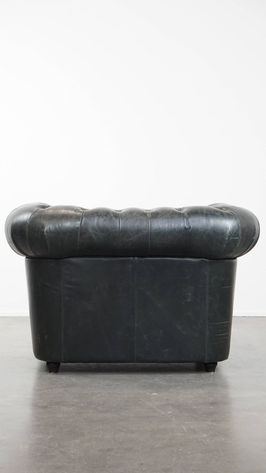 Timeless And Classic Spacious Black Chesterfield Armchair Made Of Characterful Grained Cowhide photo Furniture