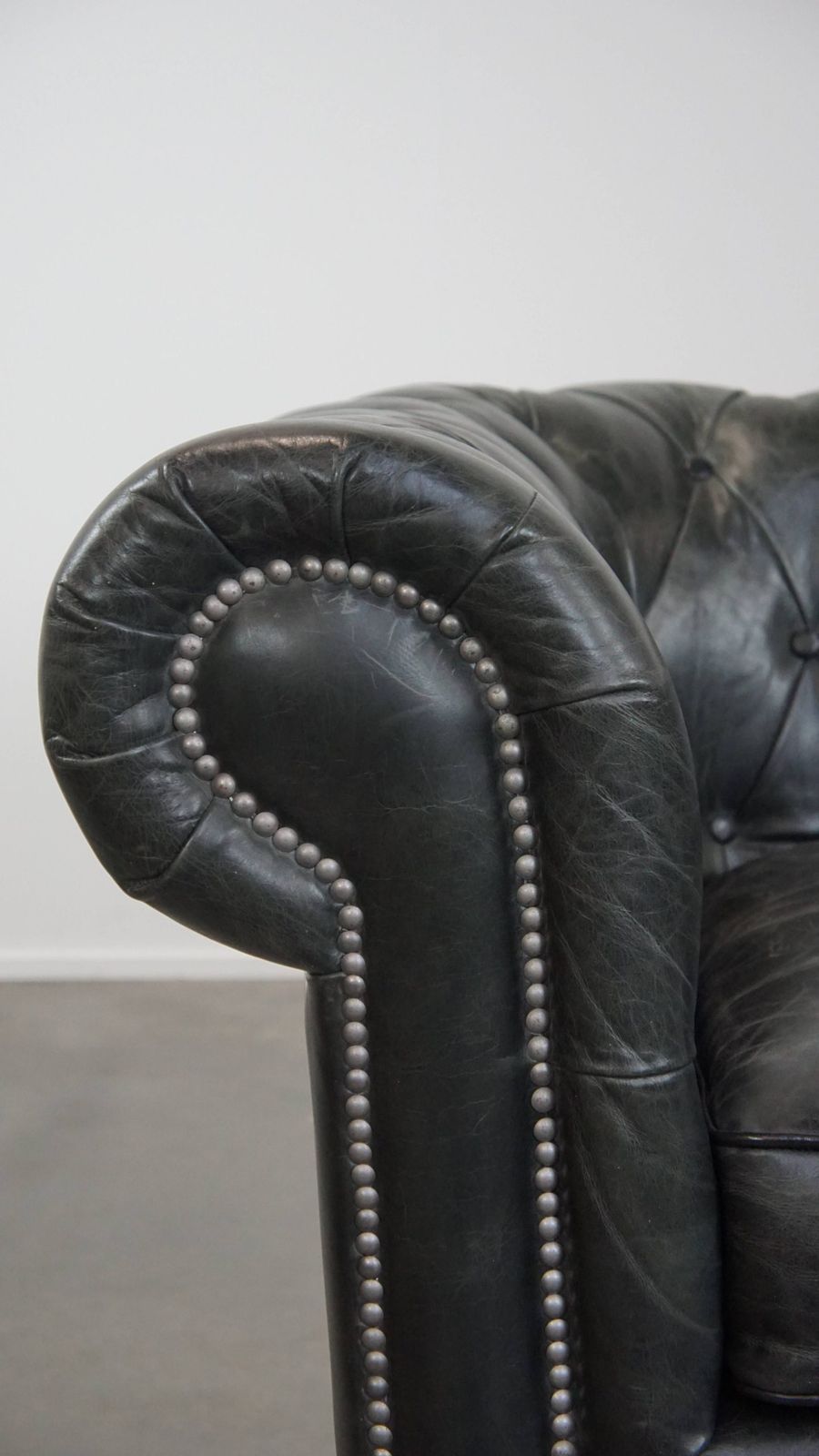 photo for sale Timeless And Classic Spacious Black Chesterfield Armchair Made Of Characterful Grained Cowhide