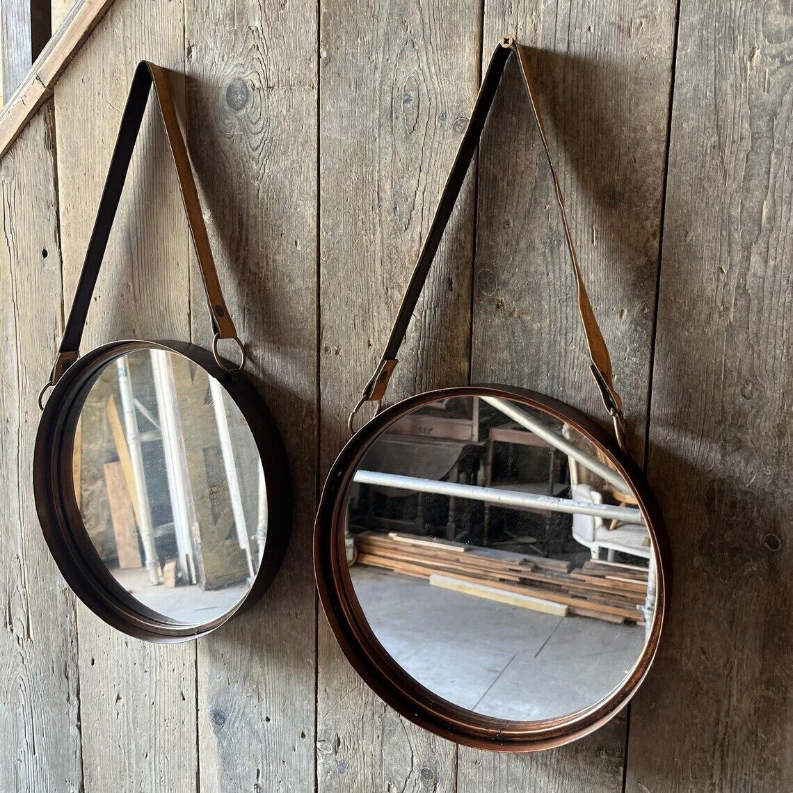 A Pair Of Wall Hanging Circular Metal Framed Mirror With Hanging Strap