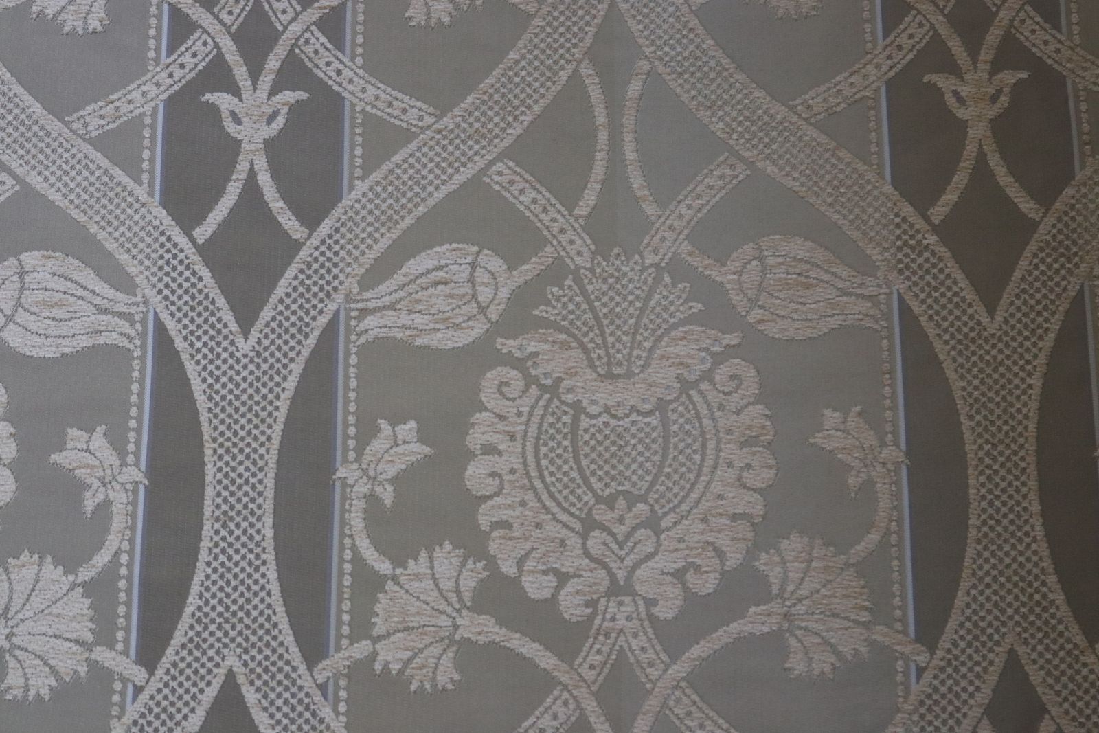 Roll Of Gold Fabric With A Decorative Design photo for sale
