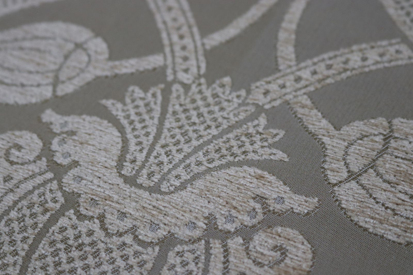 Roll Of Gold Fabric With A Decorative Design photo 150.0