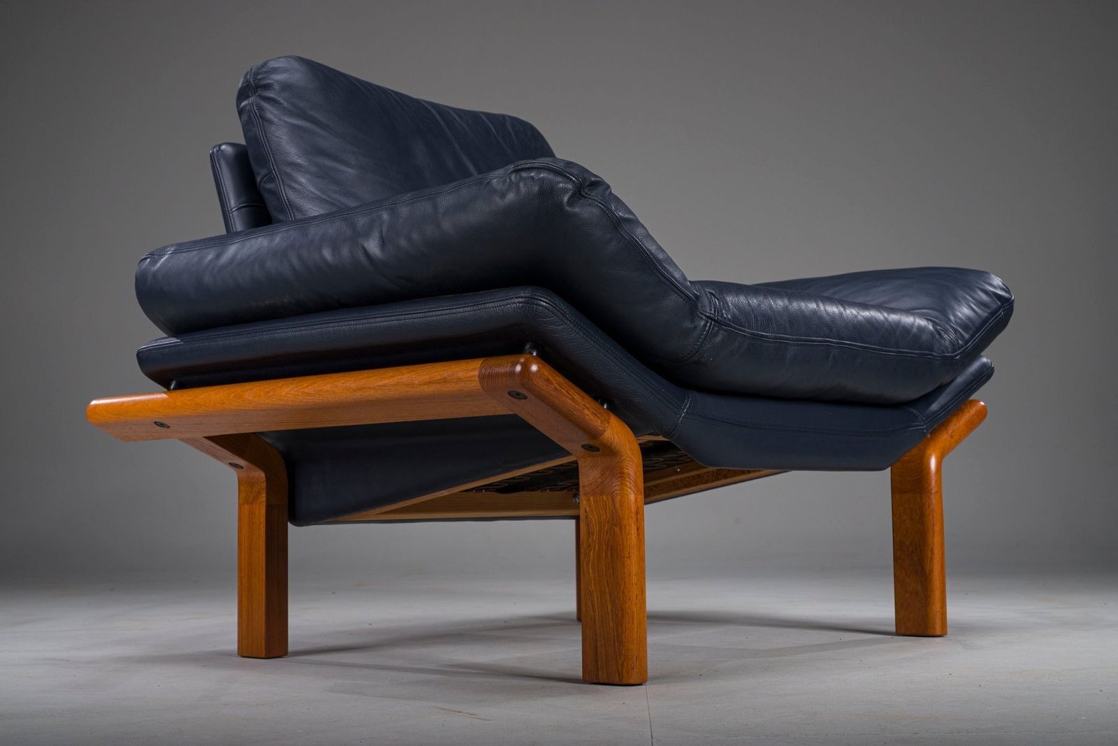 Danish Teak And Navy Blue Leather Lounge Chair From Komfort, 1970s photo for sale