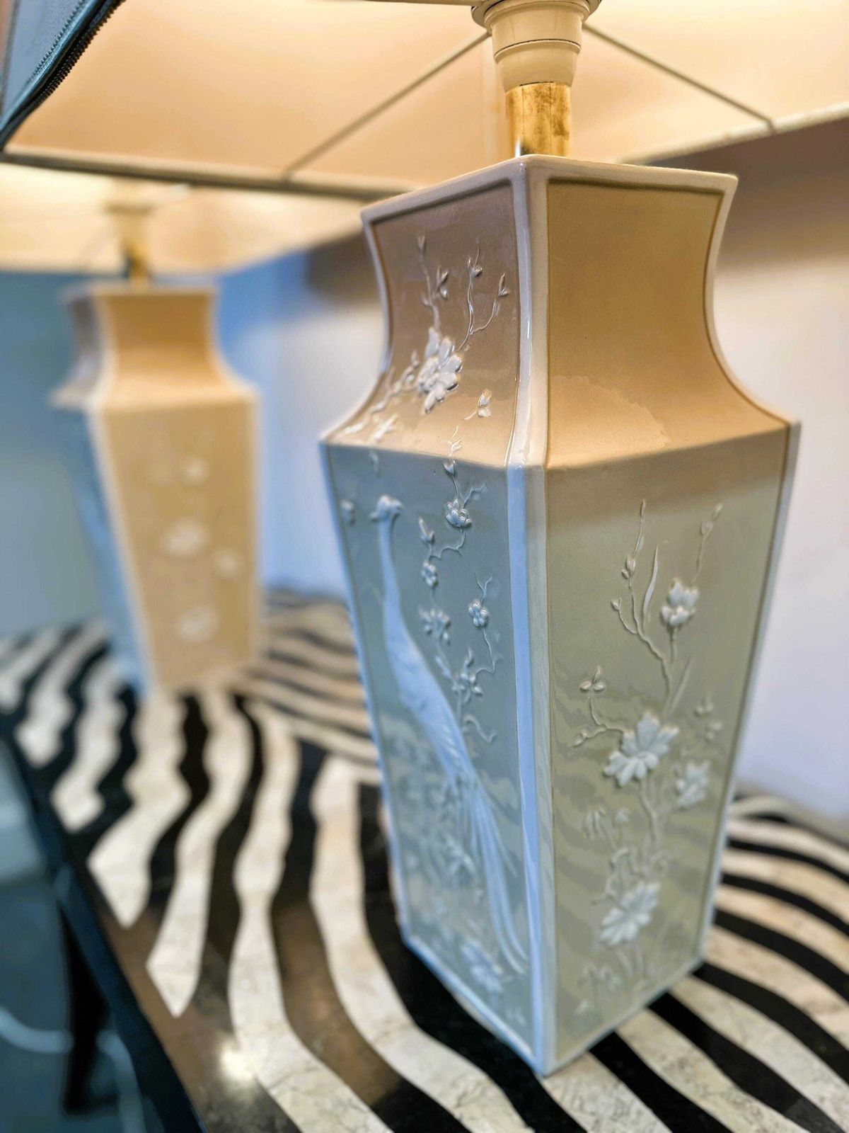 photo furniture Pair Of Large Cream Ceramic Table Lamps With Relief Peacocks And Fabric Shades, 1980s