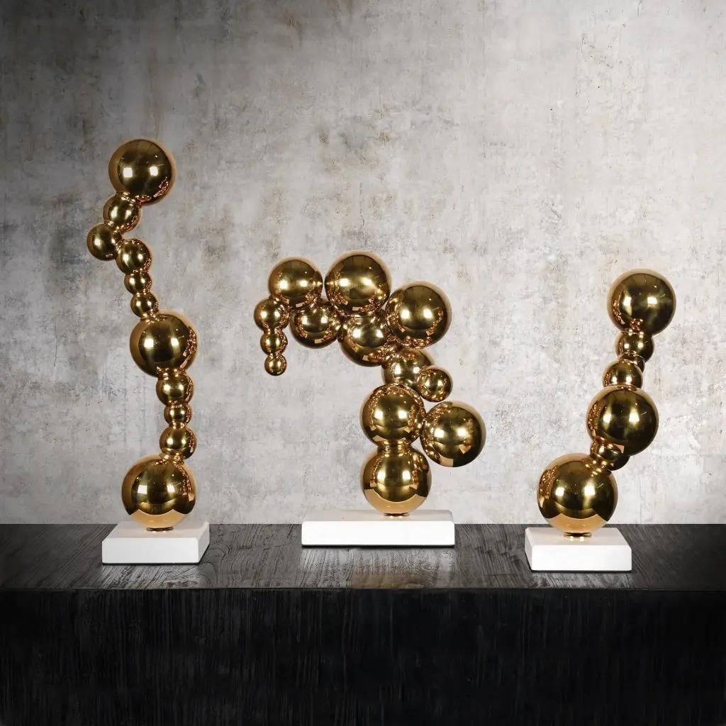 Set Of 3 Contemporary Golden Bronze Bubble Sculptures On White Marble Bases photo furniture