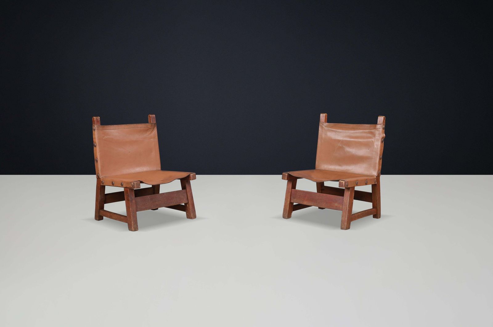 Brutalist Patinated Leather And Wood Easy Chairs, Spain, 1950s photo furniture