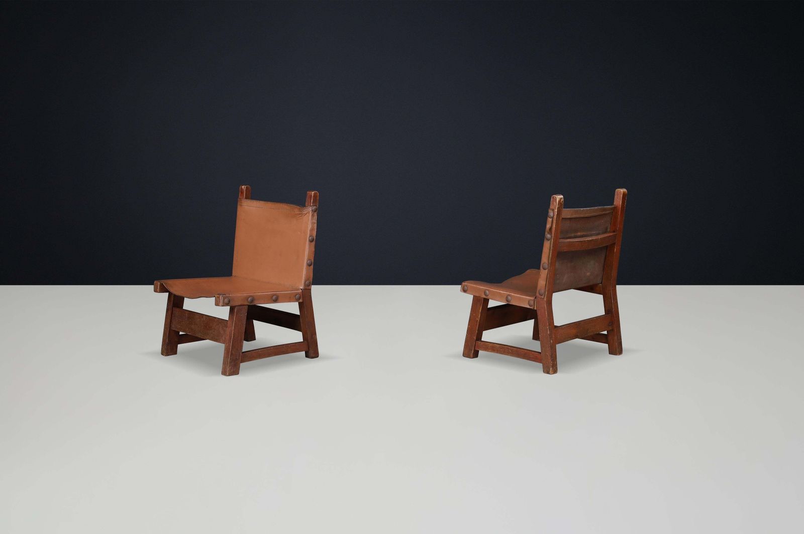 Brutalist Patinated Leather And Wood Easy Chairs, Spain, 1950s photo vinterior