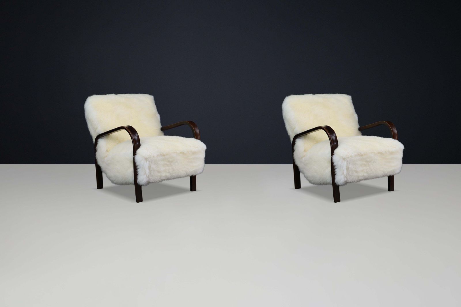 photo furniture 1940s Kozelka & Kropacek Armchairs In Ivory Texel Sheepskin Dark Patinated Frame