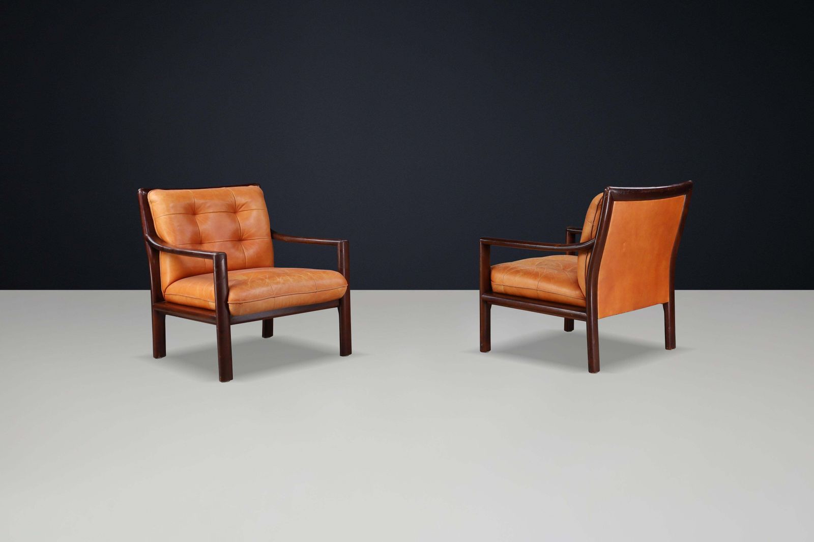 Pair Of Mid Century Lounge Chairs In Cognac Leather & Mahogany Stained Hardwood photo buy