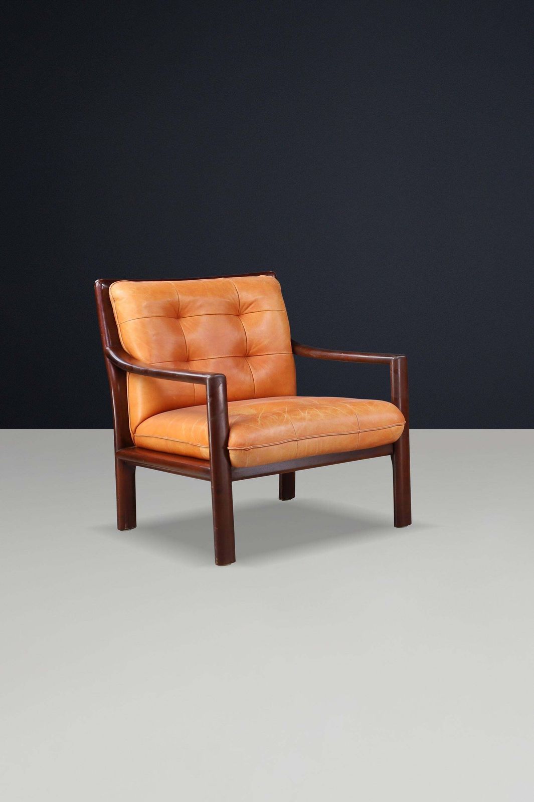 photo furniture Pair Of Mid Century Lounge Chairs In Cognac Leather & Mahogany Stained Hardwood