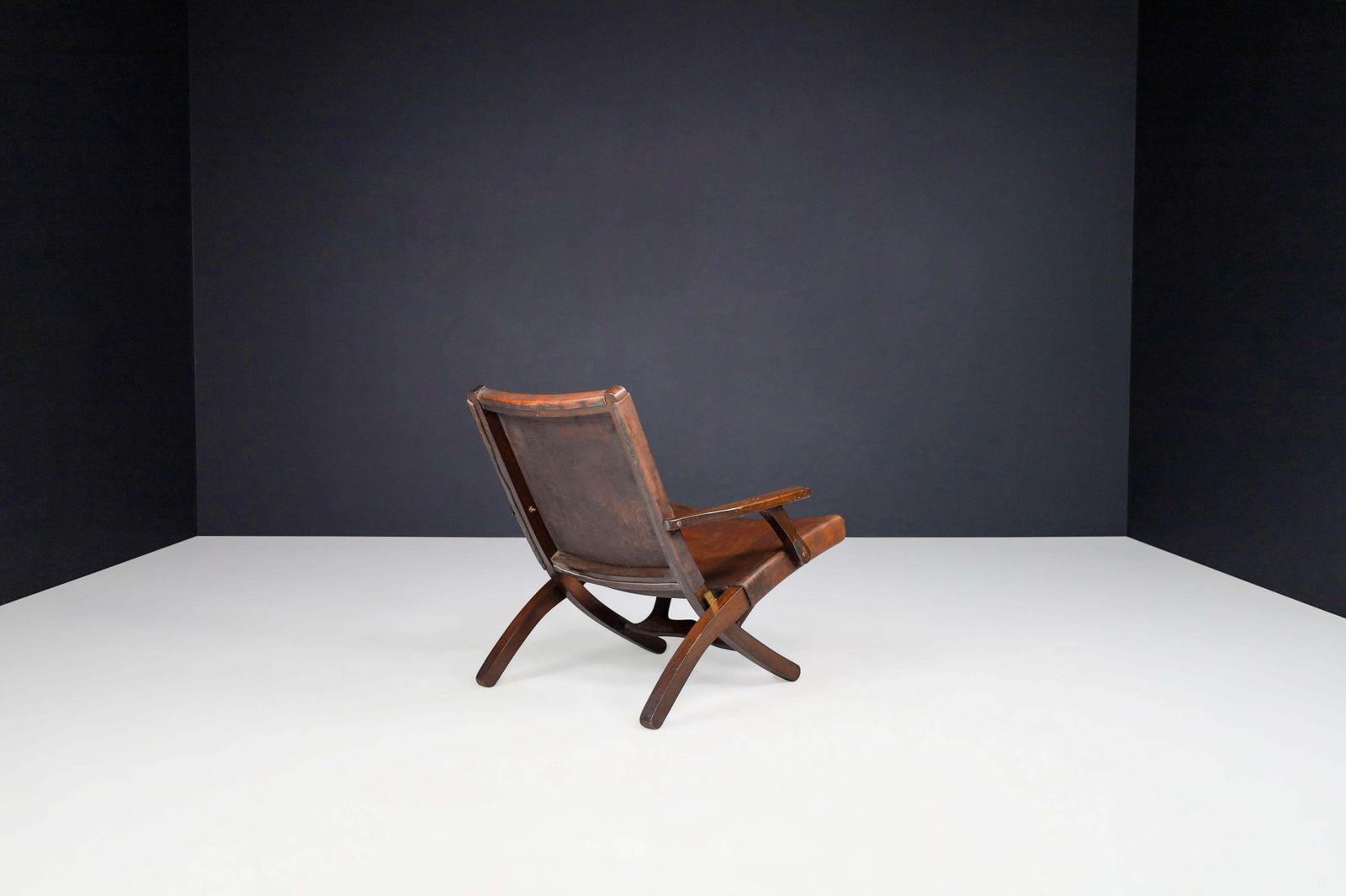 photo furniture Angel I. Pazmino Cognac Colored Saddle Leather Arm Chairs Ecuador 1970s