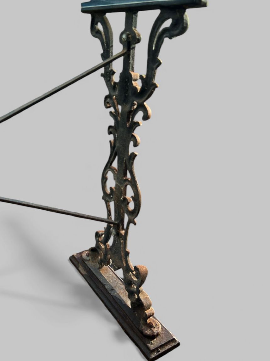A Striking Antique Cast Iron Dining Table With A Modern Glass Top photo furniture