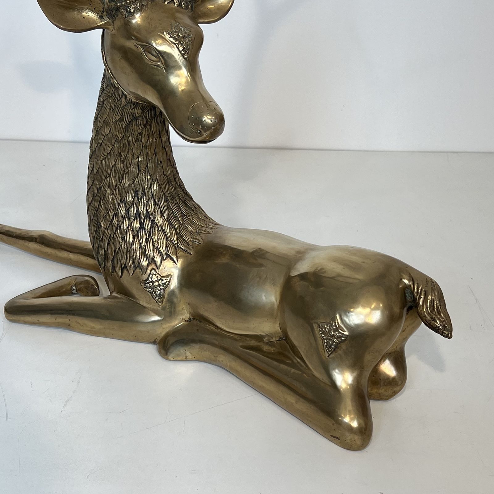 photo for sale Important Bronze Stag Reclining Engraved With Shamanic Motifs