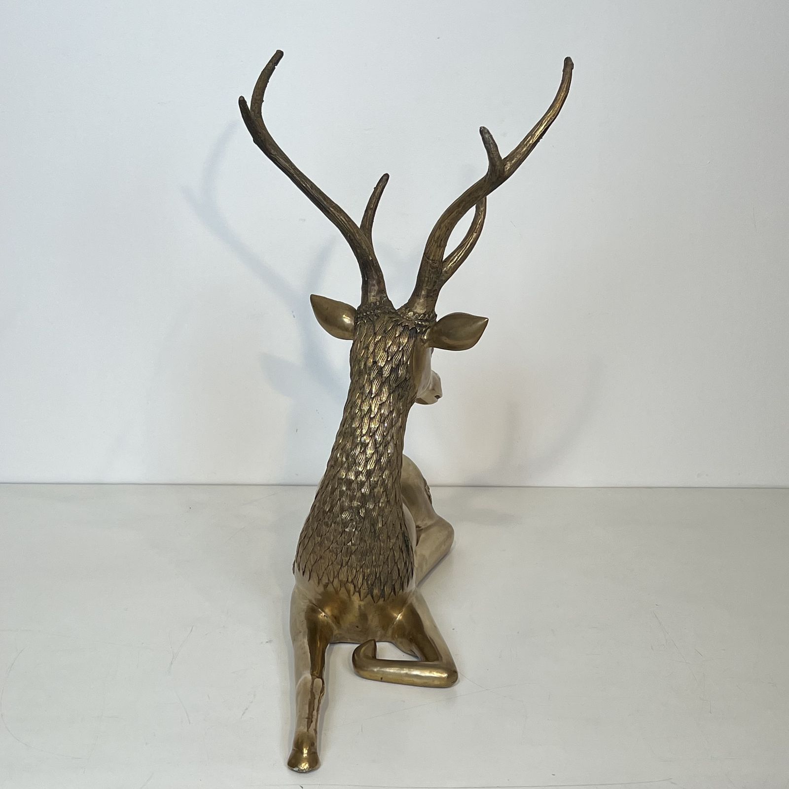 photo buy Important Bronze Stag Reclining Engraved With Shamanic Motifs