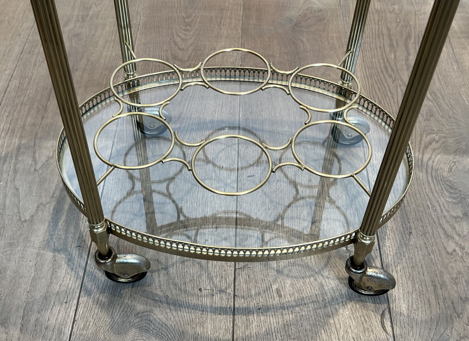photo for sale Oval Brass Rolling Table In The Style Of Maison Jansen. Circa 1940