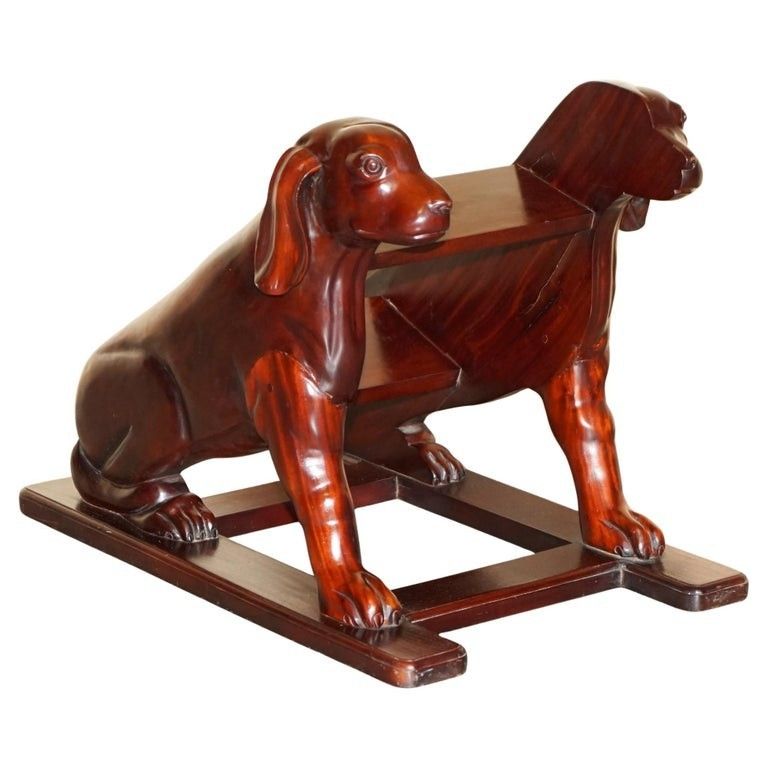 Pair Of Deep Mahogany Library Steps Depicting Ornately Carved Dogs To The Sides