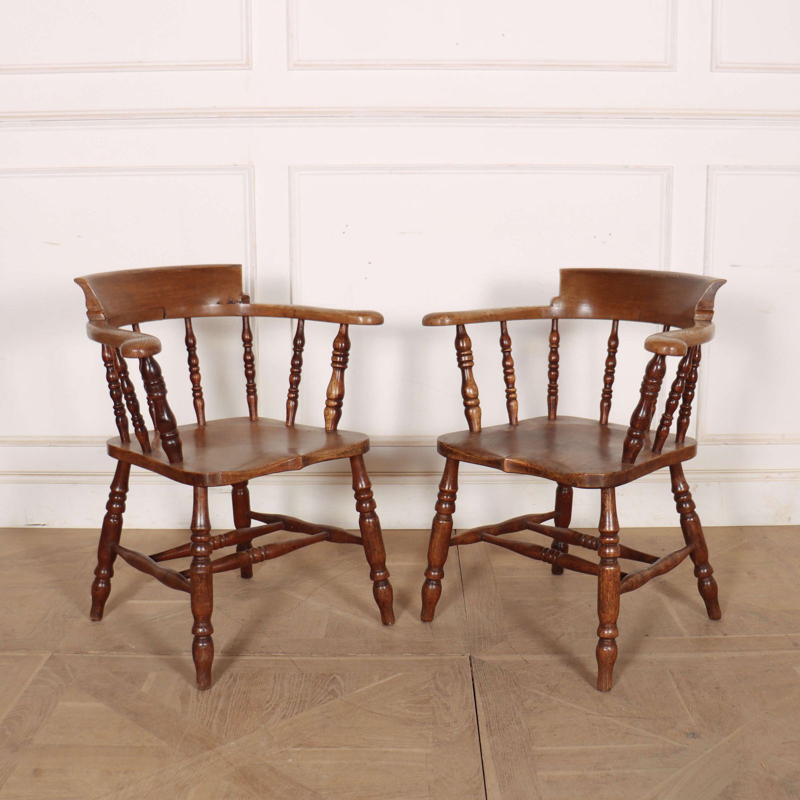 Pair Of English Smokers Bow Arm Chairs