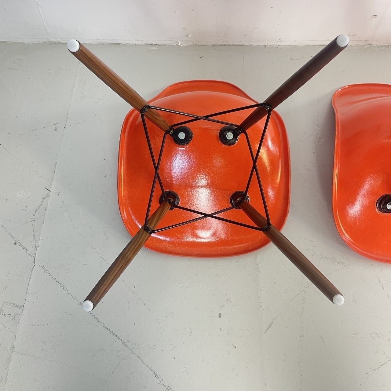 photo furniture Eames Herman Miller Dsw Side Chairs In Coral Orange