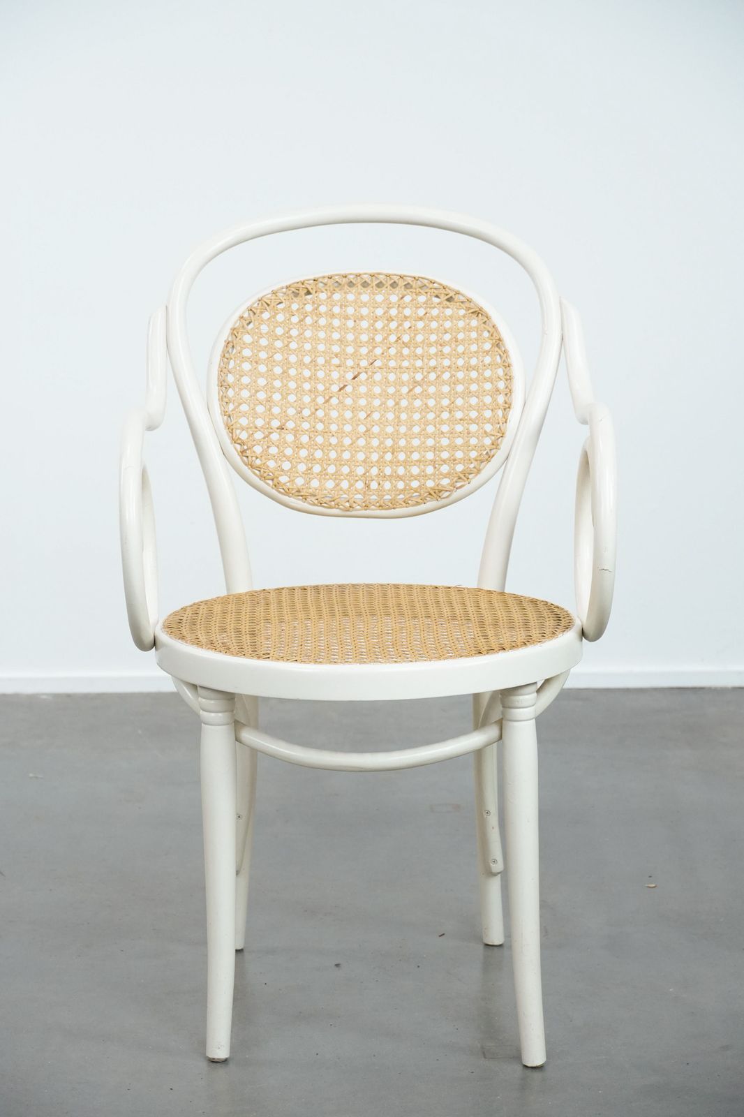 Vintage White Bistro Chair With Armrests In Thonet Style With A Graceful Curved Wooden Frame, Webbing Seat And Backrest photo furniture