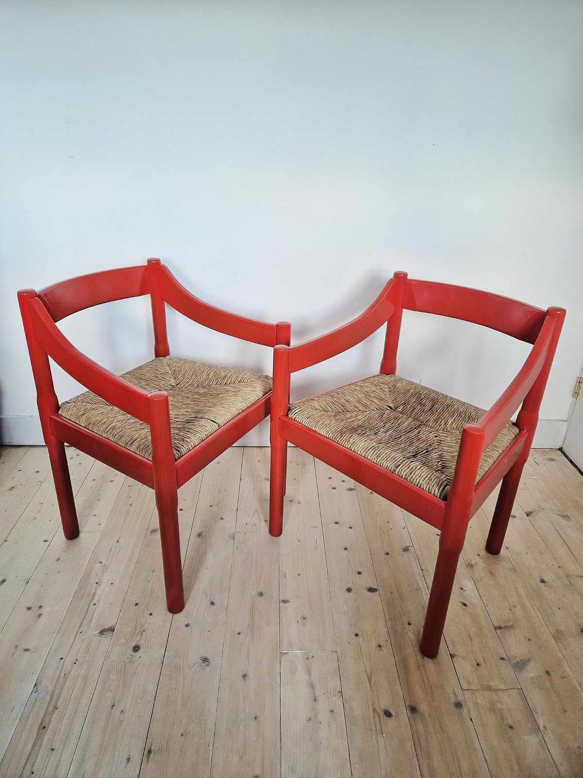 A Pair Of Red Vico Magistretti Carimate Carver Chairs photo Furniture