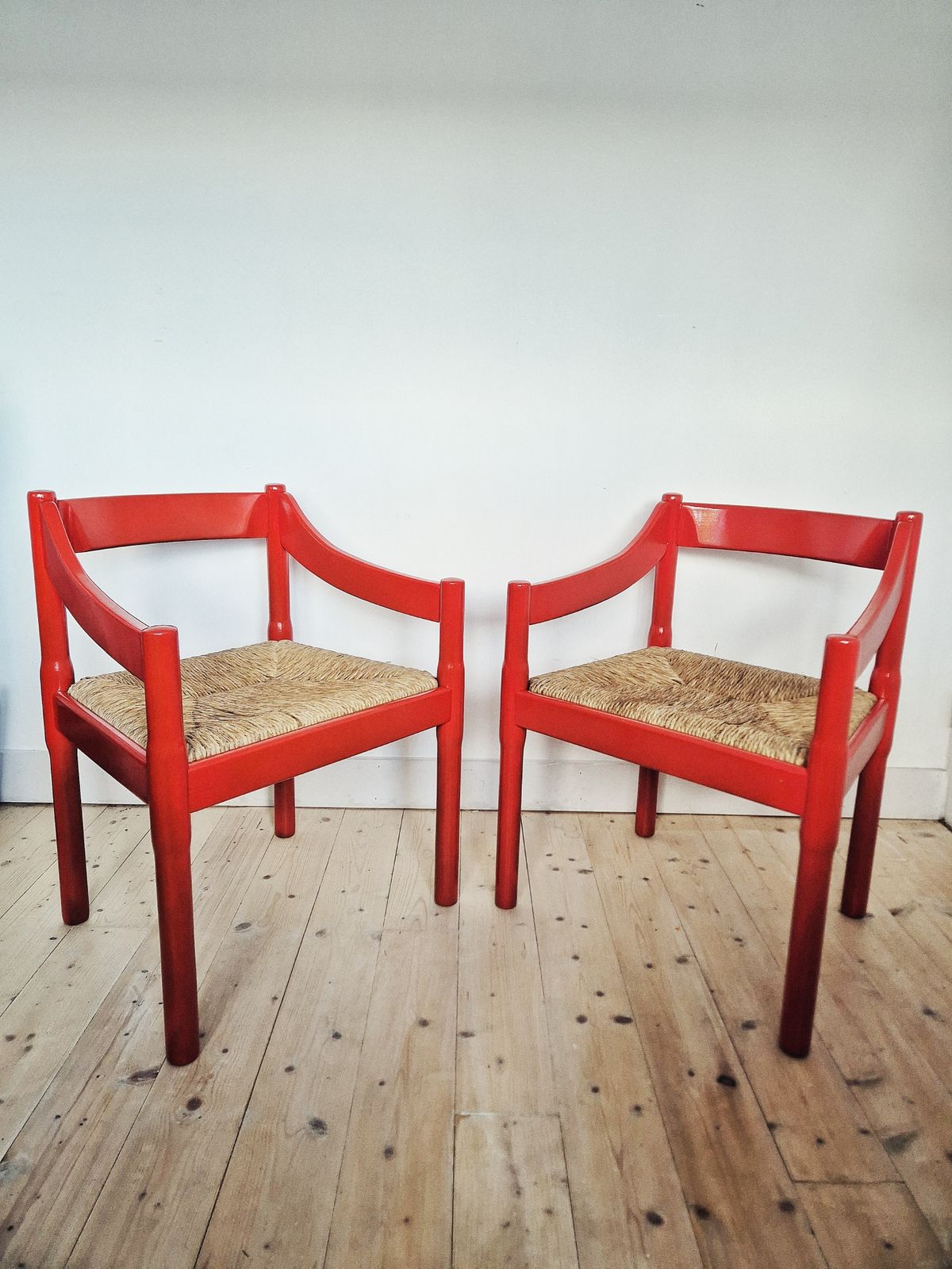 A Pair Of Red Vico Magistretti Carimate Carver Chairs photo 1200.0