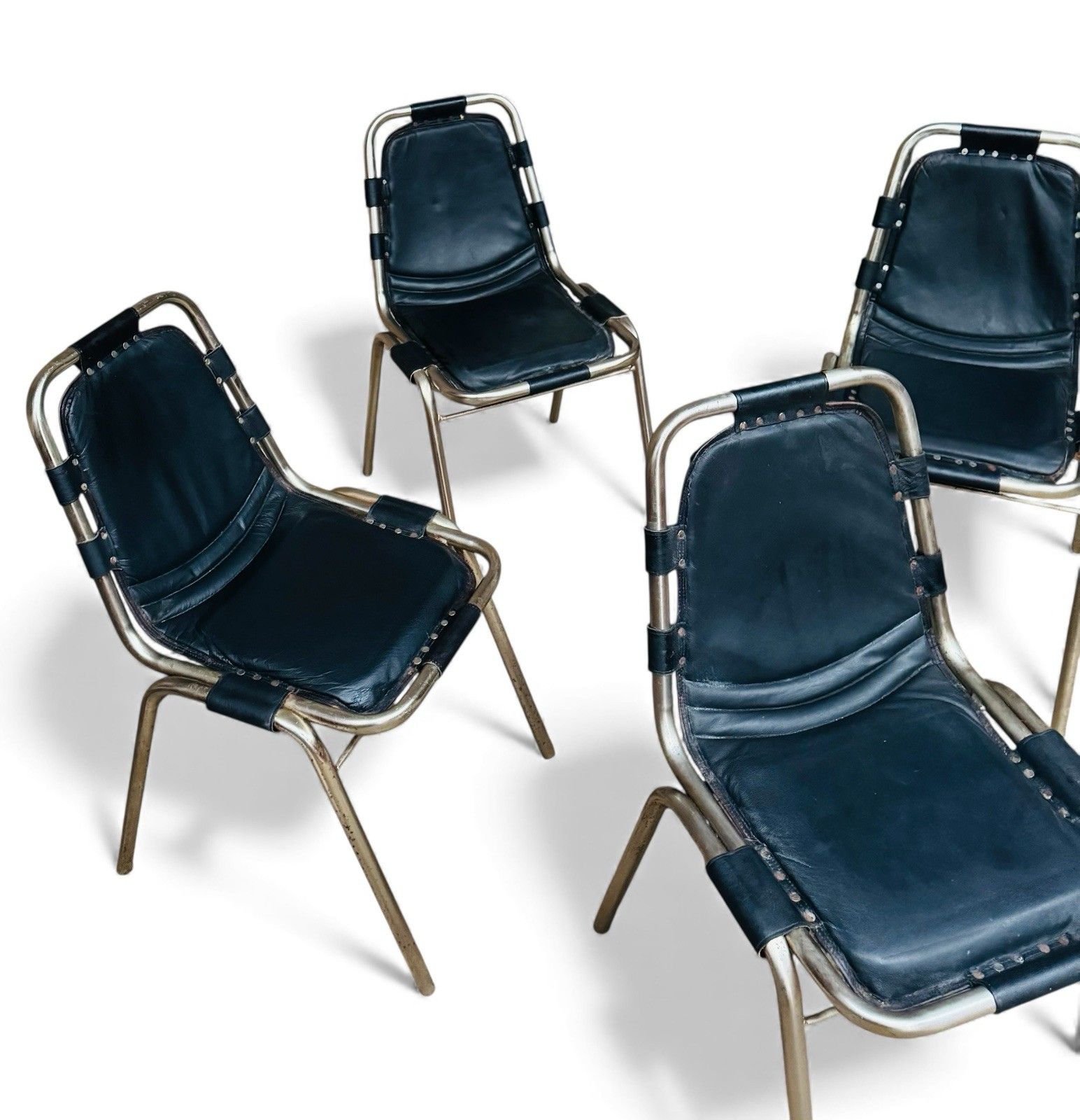 photo vintage Set Of Four Les Arcs Steel And Leather Dining Chairs Charlotte Perriand Style