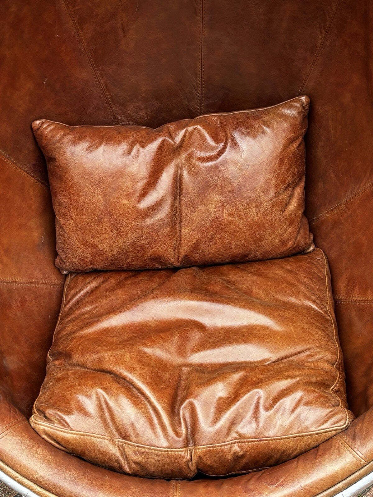 photo furniture Aviation Swivel Egg Chair With Tan Leather.