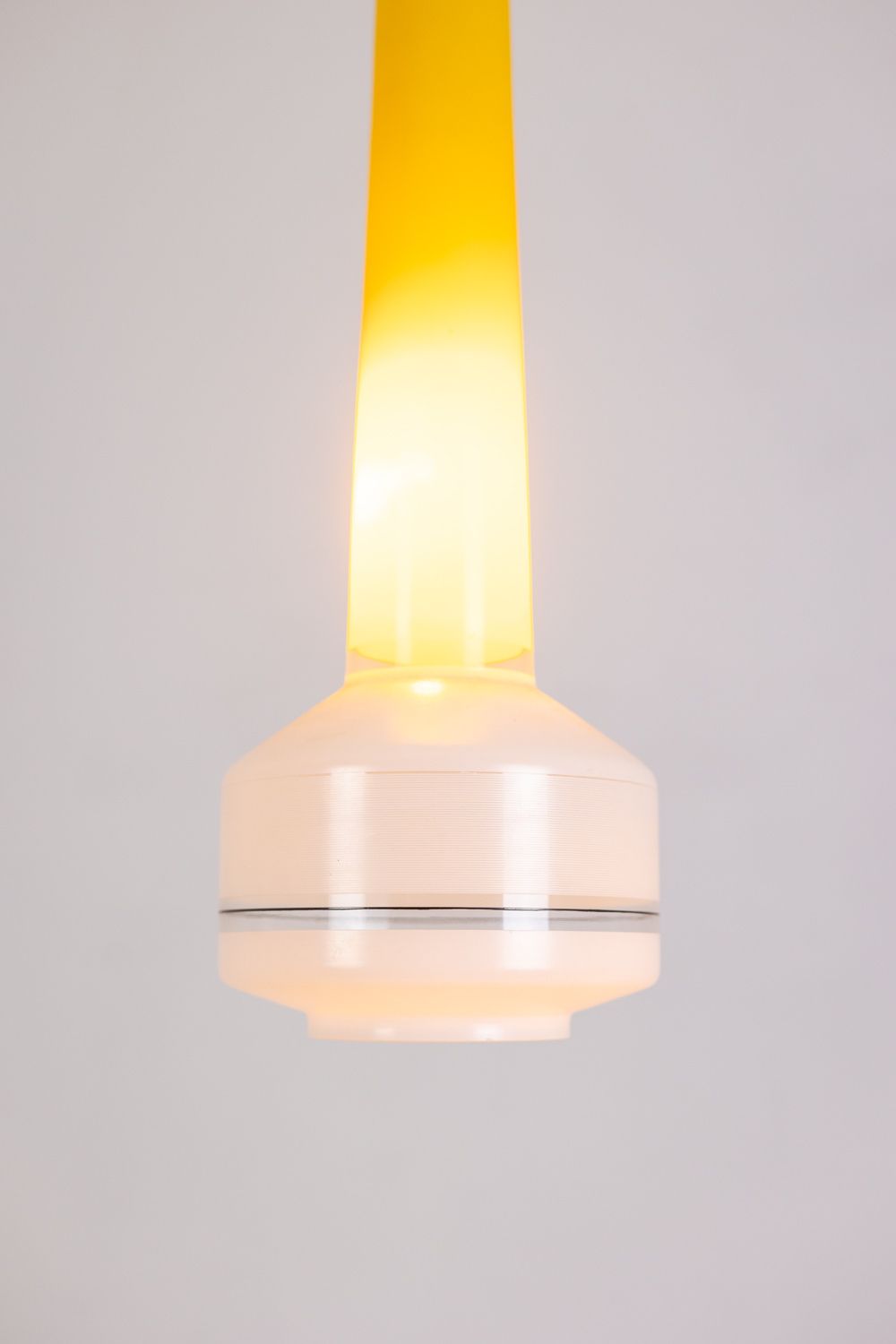 Pair Of Two Tone Yellow And White Glass Pendant Lights. 1960s photo vintage