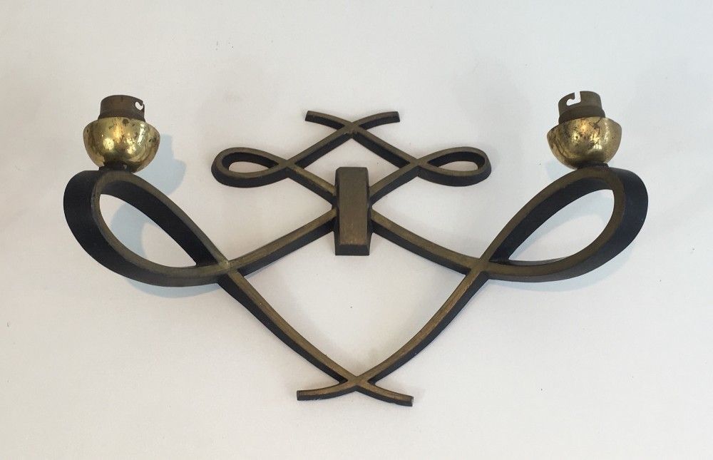 In The Style Of Jules Leleu. Pair Of Black Lacquered And Brass Design Wall Sconces. Circa 1950 photo for sale