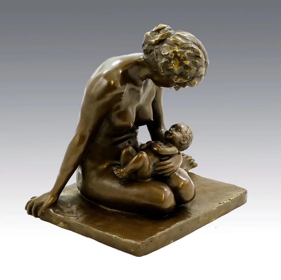 Bronze Sculpture Depicting A Mother And Her Child photo for sale