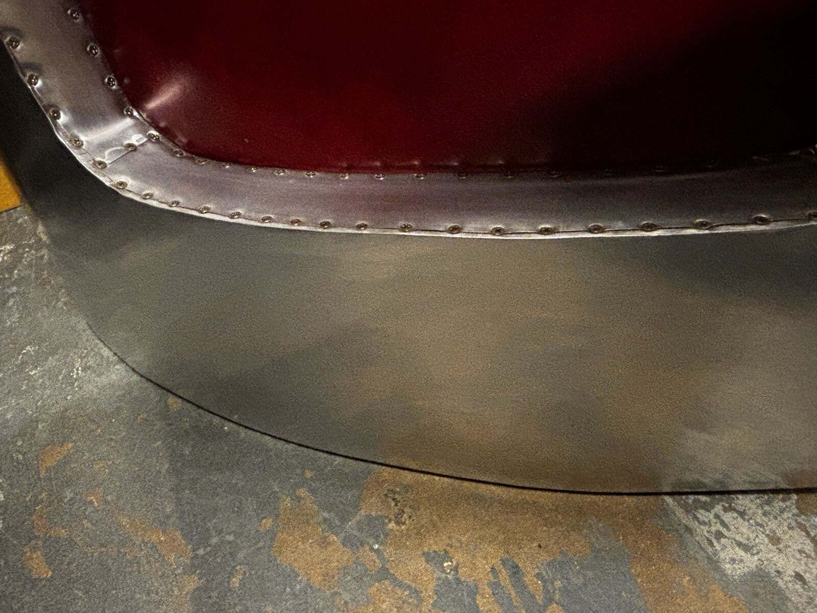 photo furniture Aviators Polished Metal Armchair, With Red Leather Upholstery.