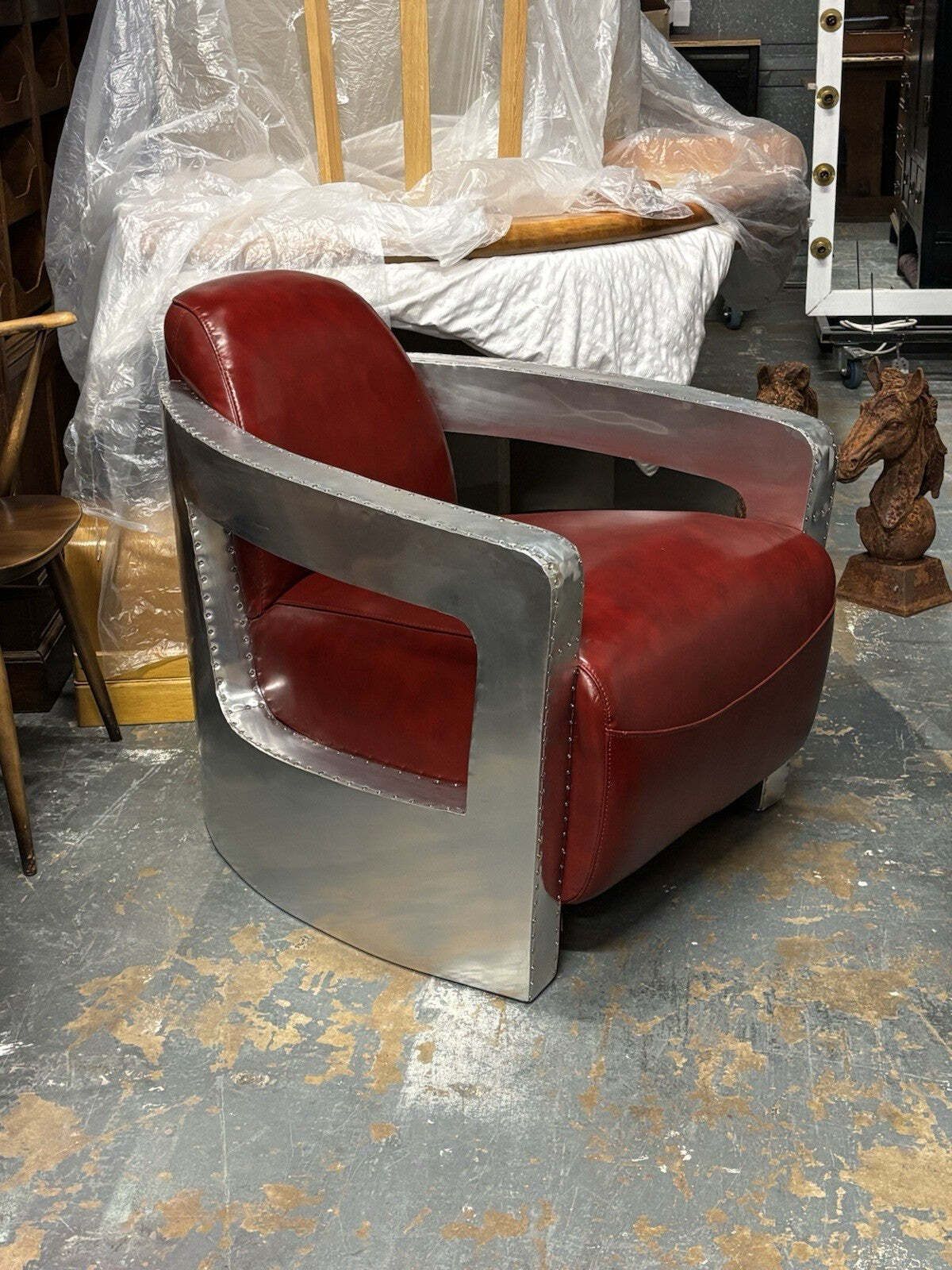 photo buy Aviators Polished Metal Armchair, With Red Leather Upholstery.