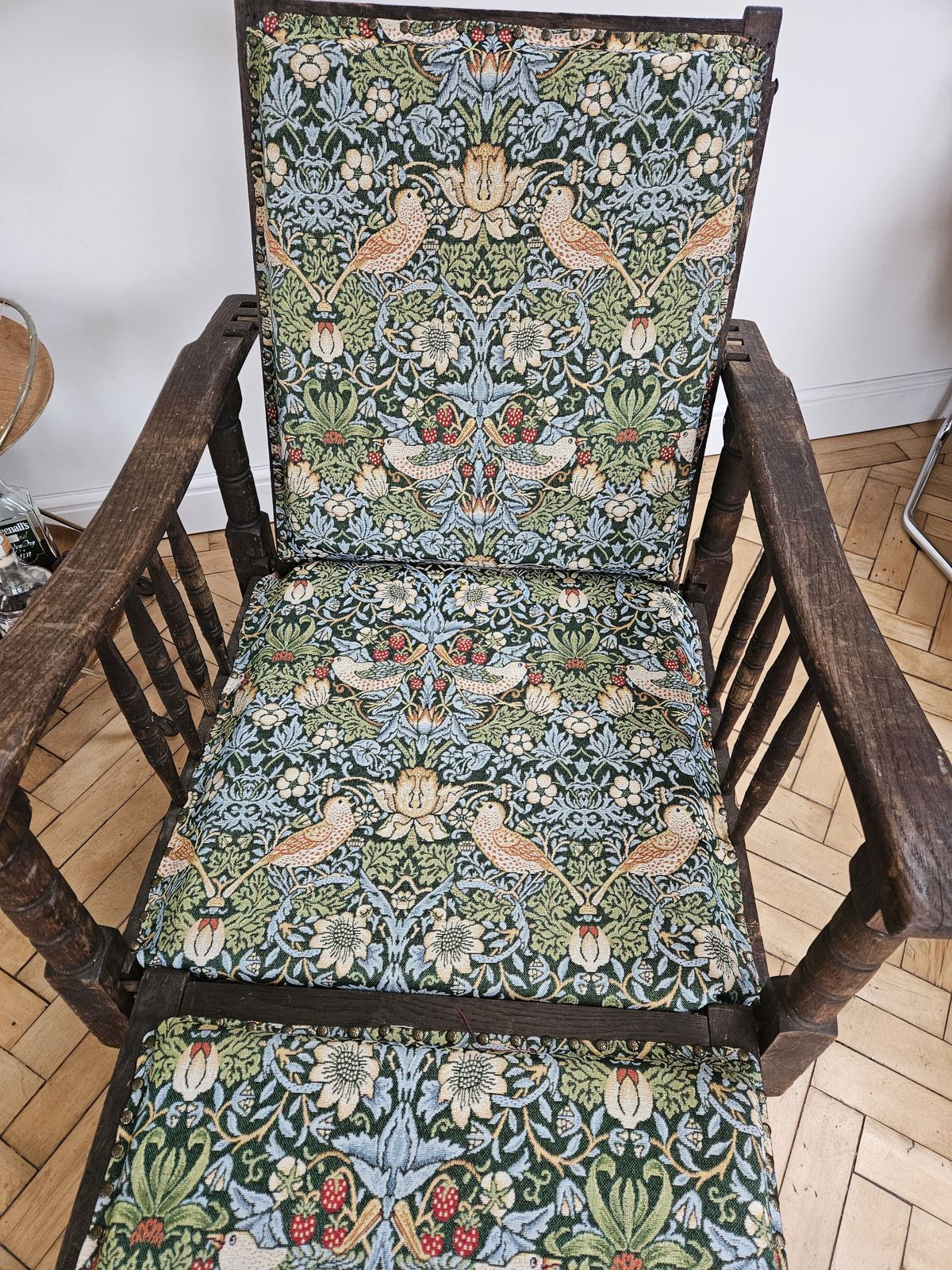 William Morris Style Steamer Chair Coverdd In William Morris Strawberry Thief Upholstery photo furniture